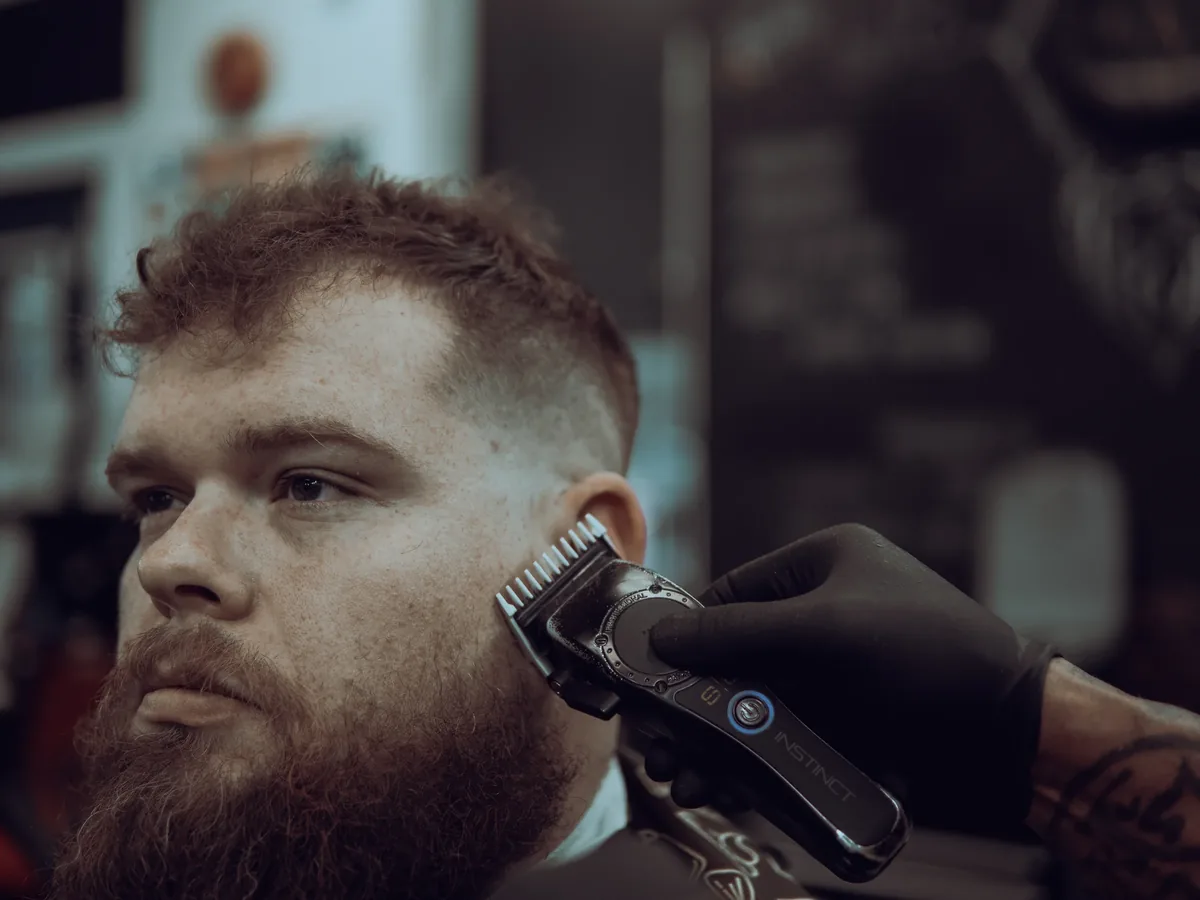 A client sits for a close portrait after a haircut.