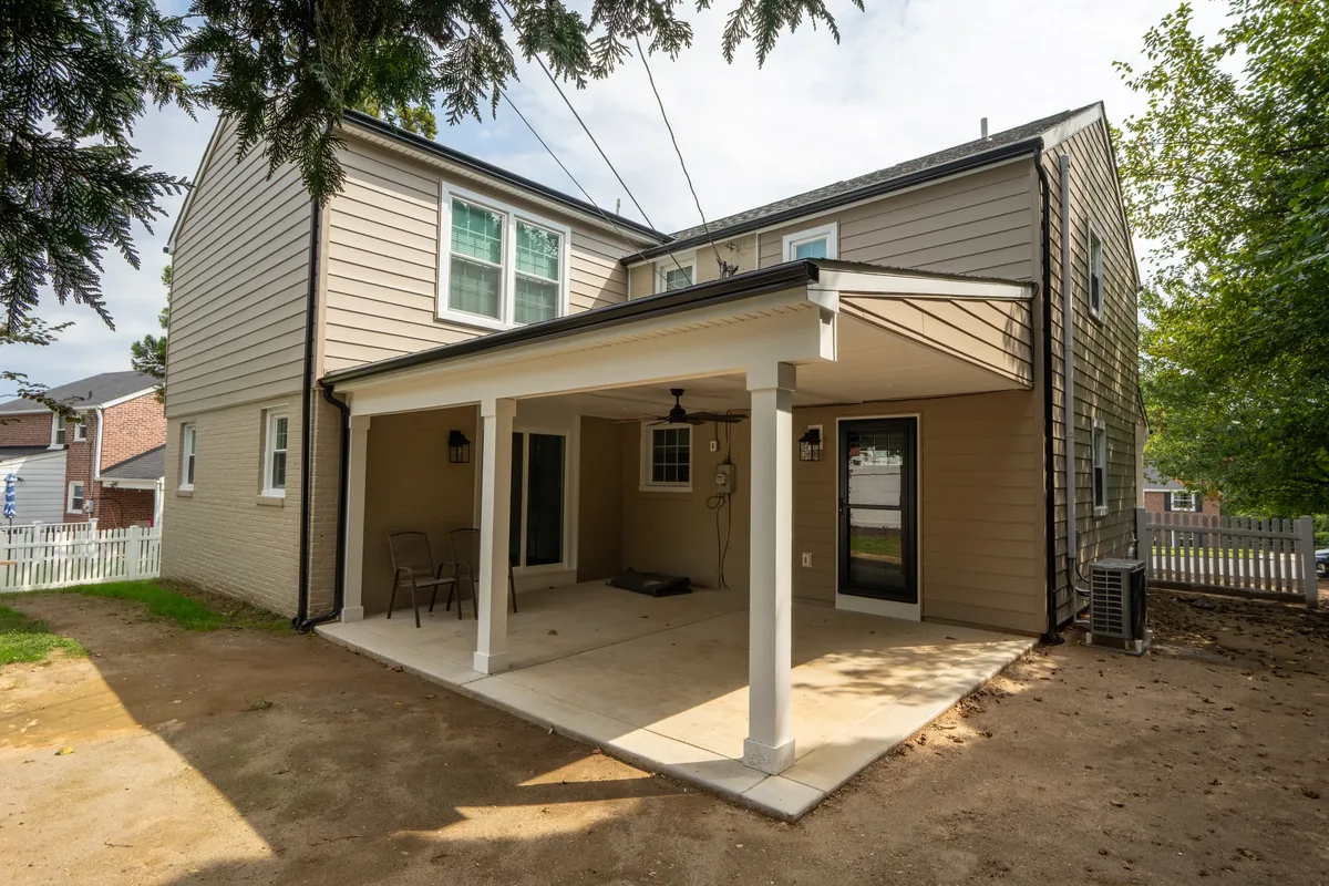 A home exterior with a covered patio and updated siding.