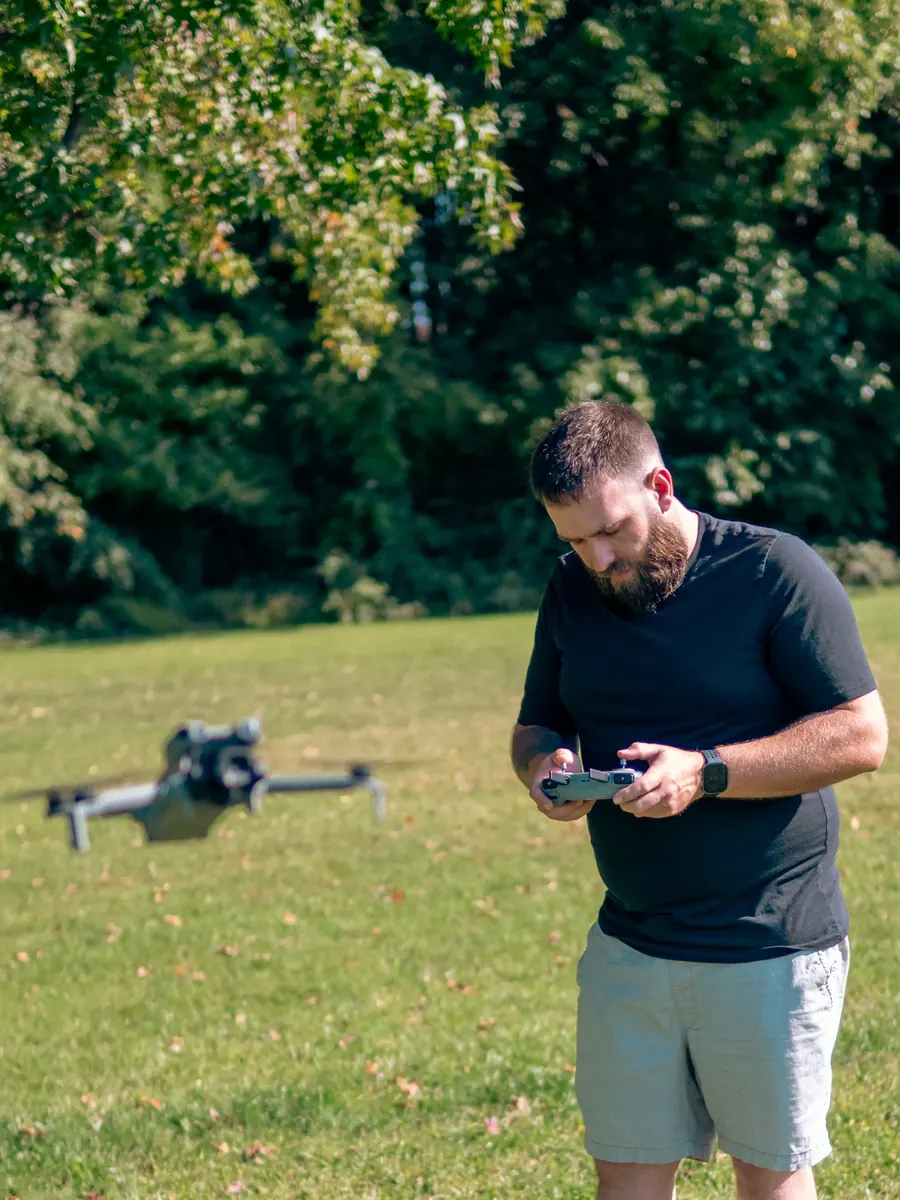 Jamison operating a drone on location